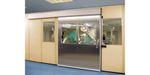 Sistema de puertas correderas , referencia Unislide H de ASSA ABLOY. Control higiénico en entornos de sala blanca